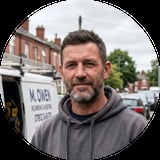 Man with beard wearing gray hoodie