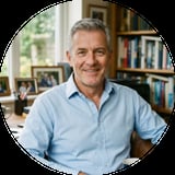 Middle-aged man with gray hair wearing a light blue button-up shirt